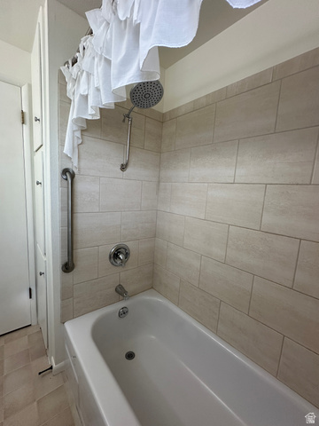 624 East Cutler Springville, UT 84663 - Photo 24 of 24 Upstairs bathroom with white bathtub with chrome fixtures, subway tile surround, and a rain showerhead