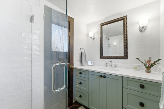 2635 Little Kate Road, Unit 21 Park City, UT 84060 - Photo 20 of 39 Full bath featuring vanity, a stall shower, and a textured wall