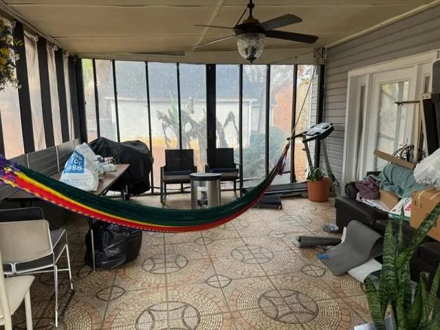 a room with gym equipment and a large mirror