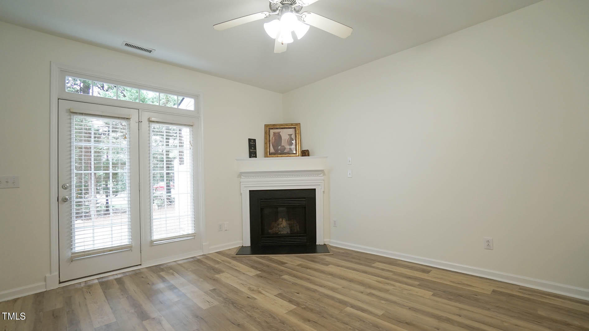 8215 Martello Lane Raleigh, NC 27613 - Photo 8 of 19 Gas fireplace for those cozy fall nights to come.