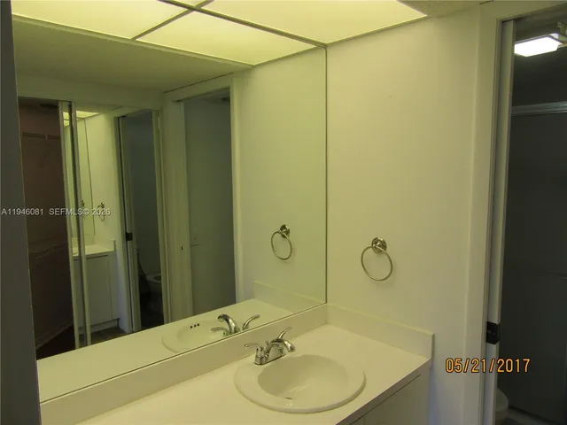 a bathroom with a sink and shower