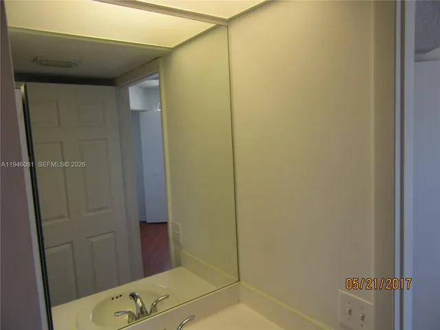 a bathroom with a tub and shower