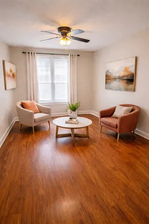 a living room with furniture and a window