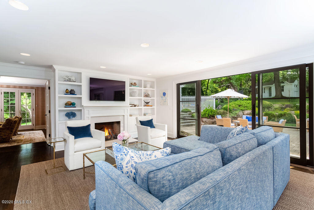 14 Dingletown Road Greenwich, CT 06830 - Photo 13 of 56 a living room with furniture a large window and a fireplace