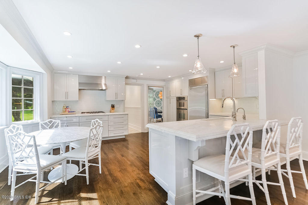 14 Dingletown Road Greenwich, CT 06830 - Photo 16 of 56 a dining room with furniture and a kitchen view