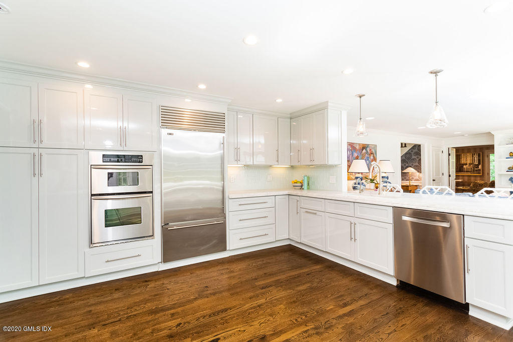 14 Dingletown Road Greenwich, CT 06830 - Photo 17 of 56 a kitchen with stainless steel appliances granite countertop a refrigerator and a stove top oven