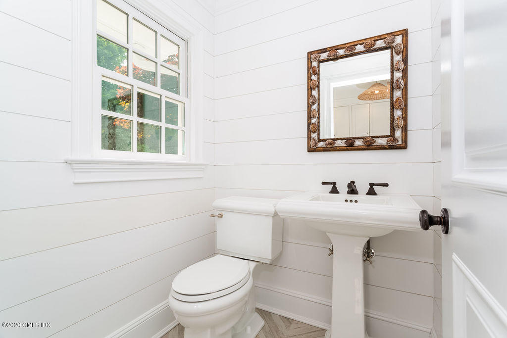14 Dingletown Road Greenwich, CT 06830 - Photo 26 of 56 a bathroom with a toilet sink and mirror