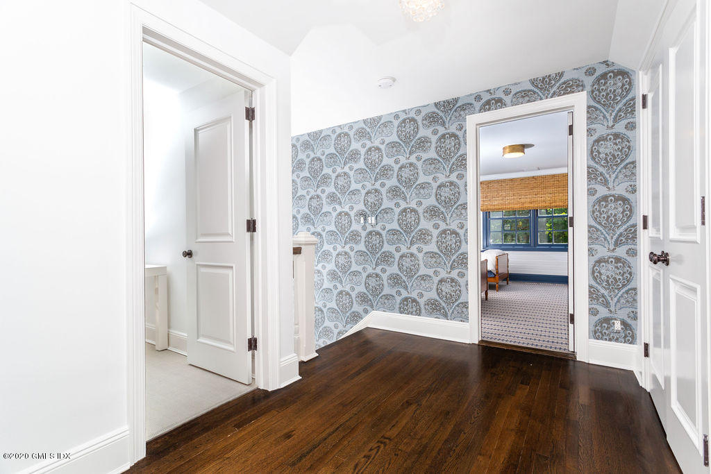 14 Dingletown Road Greenwich, CT 06830 - Photo 32 of 56 a view of a hallway with wooden floor and closet