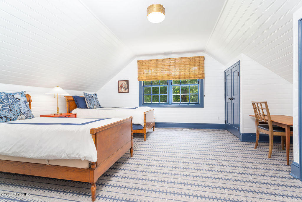 14 Dingletown Road Greenwich, CT 06830 - Photo 33 of 56 a view of a bedroom with furniture and a window