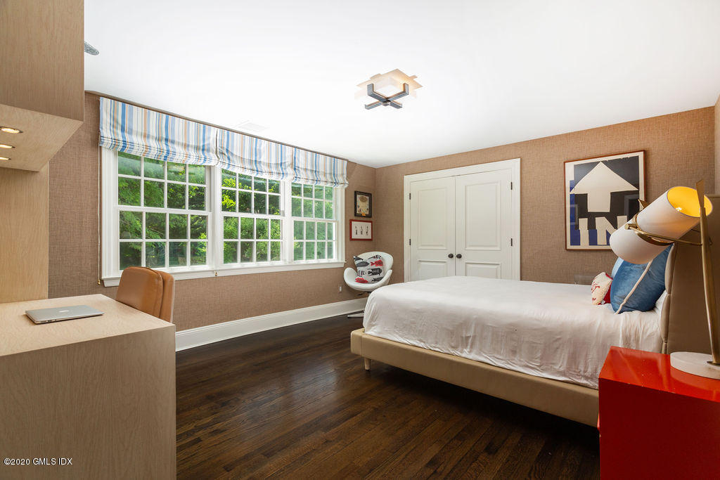 14 Dingletown Road Greenwich, CT 06830 - Photo 36 of 56 a bedroom with a bed and a window