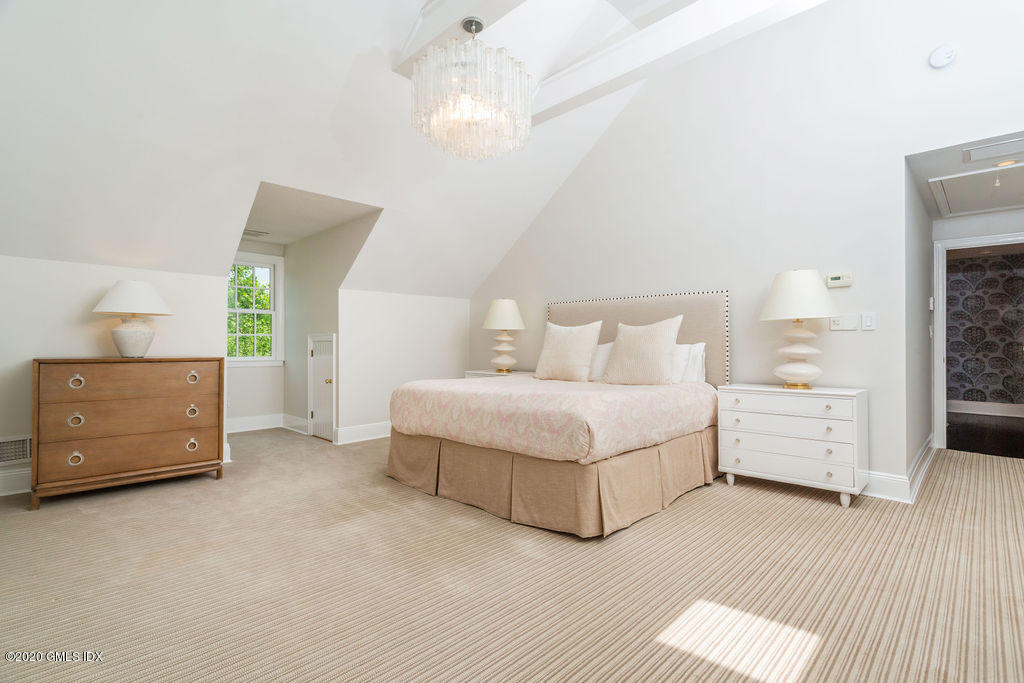 14 Dingletown Road Greenwich, CT 06830 - Photo 37 of 56 a spacious bedroom with a bed and a dresser