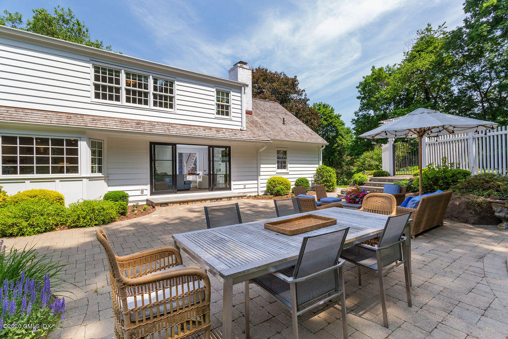 14 Dingletown Road Greenwich, CT 06830 - Photo 45 of 56 a view of a patio with table and chairs and potted plants
