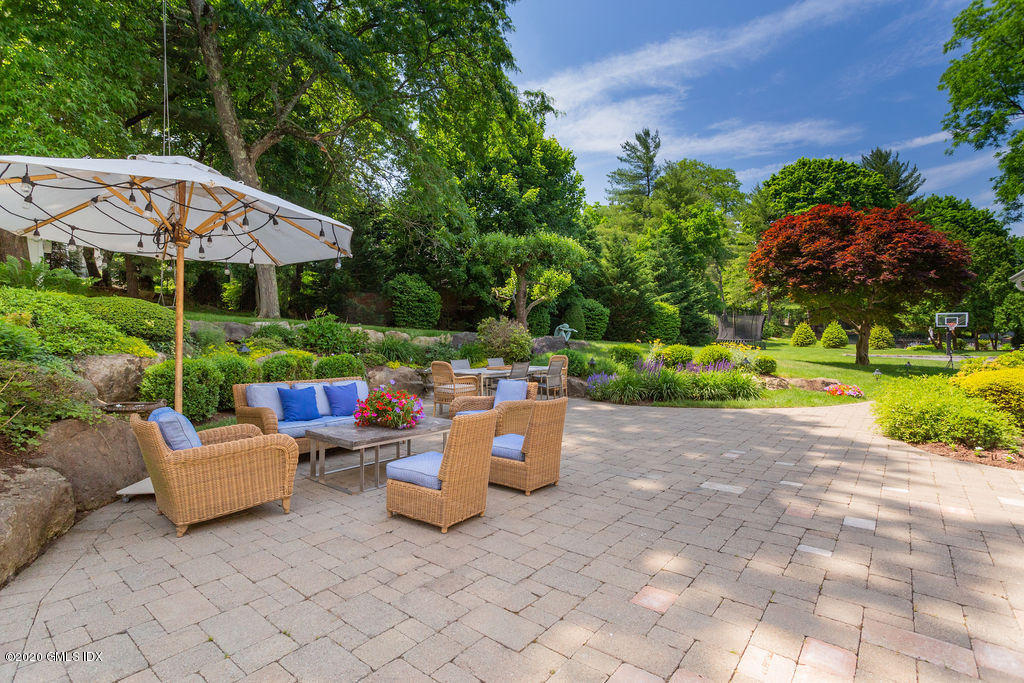 14 Dingletown Road Greenwich, CT 06830 - Photo 49 of 56 a backyard of a house with yard and outdoor seating