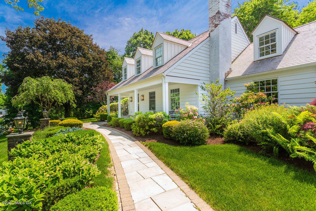 14 Dingletown Road Greenwich, CT 06830 - Photo 5 of 56 a front view of a house with a garden