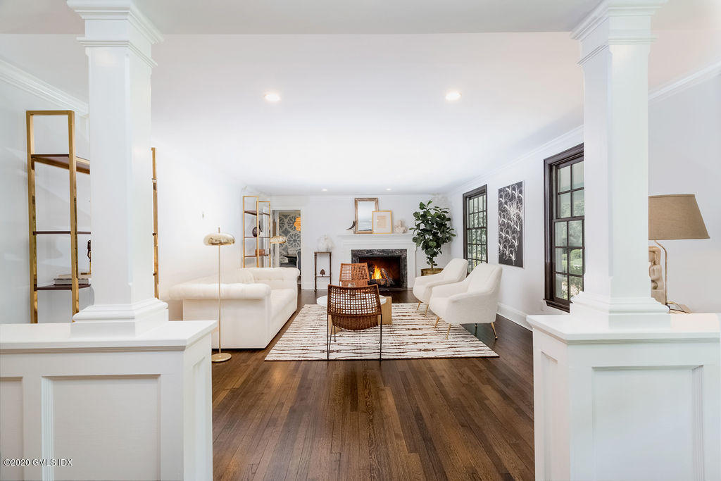 14 Dingletown Road Greenwich, CT 06830 - Photo 10 of 56 a living room with fireplace furniture and a large window