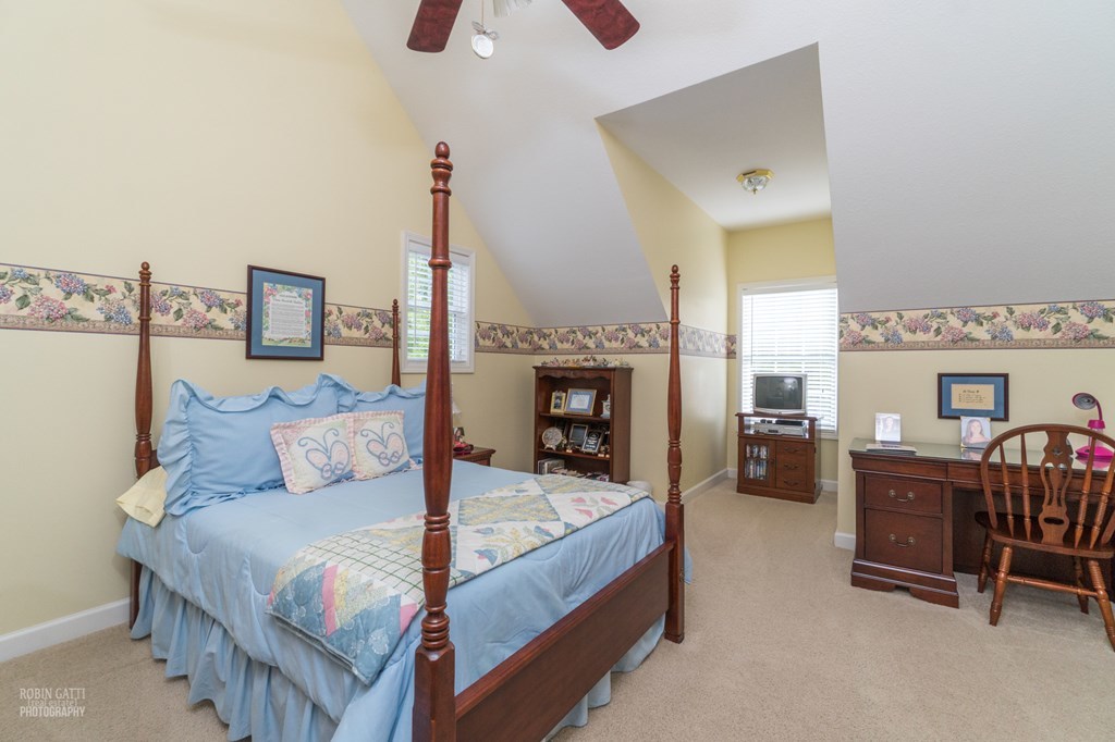 130 Orchard Ridge Drive Forsyth, GA 31029 - Photo 17 of 24 a bed room with furniture and a fireplace