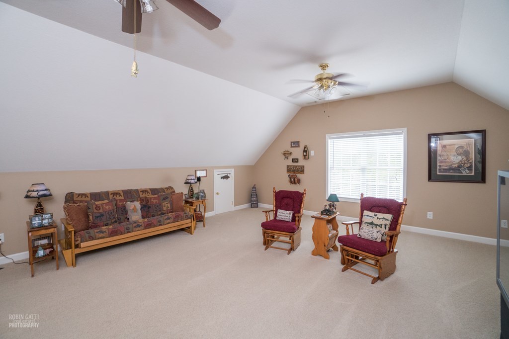 130 Orchard Ridge Drive Forsyth, GA 31029 - Photo 18 of 24 a bedroom with furniture and a window