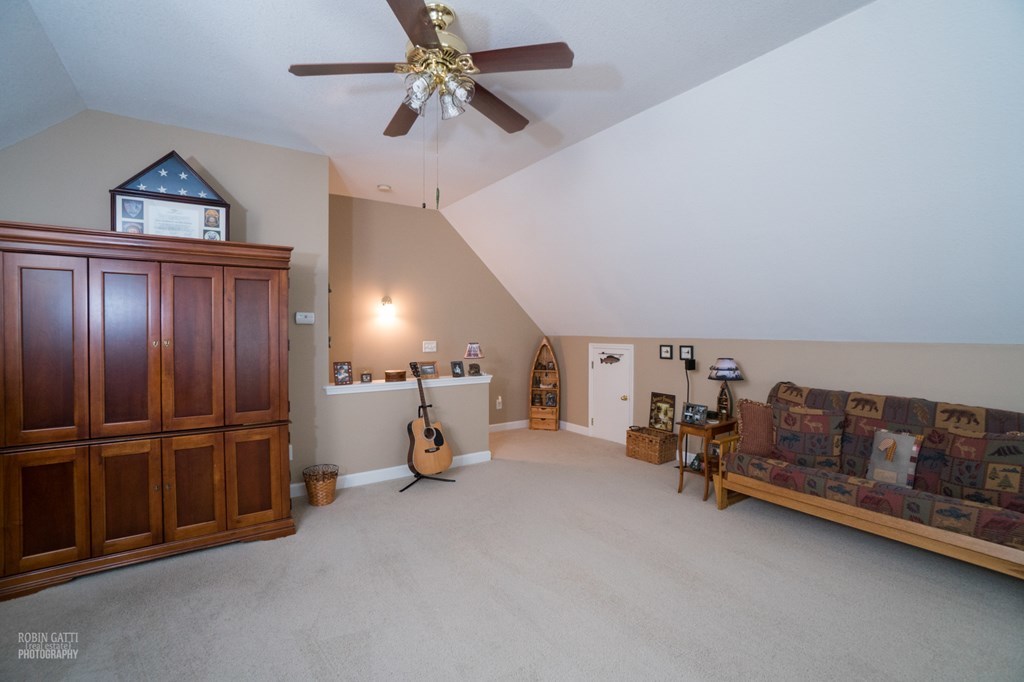 130 Orchard Ridge Drive Forsyth, GA 31029 - Photo 19 of 24 a view of a livingroom with furniture and a ceiling fan