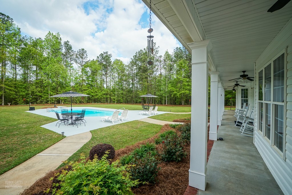 130 Orchard Ridge Drive Forsyth, GA 31029 - Photo 21 of 24 a view of a garden with a patio