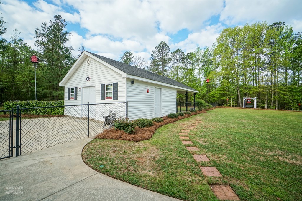 130 Orchard Ridge Drive Forsyth, GA 31029 - Photo 22 of 24 a view of a house with a yard