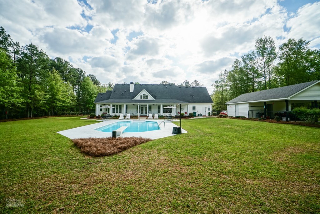 130 Orchard Ridge Drive Forsyth, GA 31029 - Photo 24 of 24 a front view of a house with a garden
