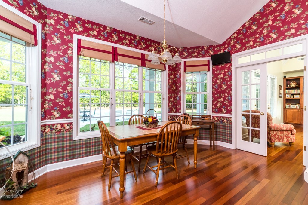 130 Orchard Ridge Drive Forsyth, GA 31029 - Photo 6 of 24 a dining room with furniture and wooden floor