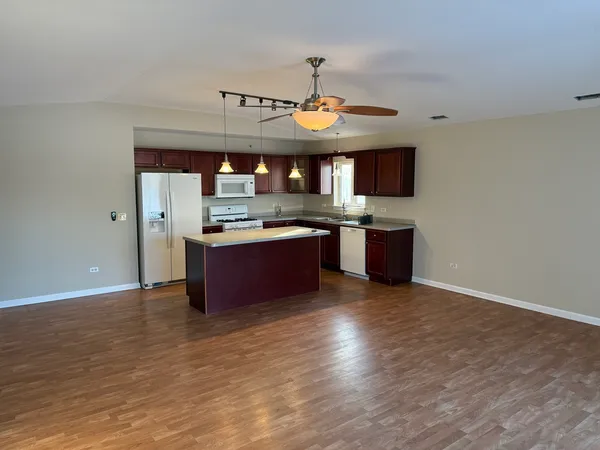 a kitchen with stainless steel appliances granite countertop a stove and a sink