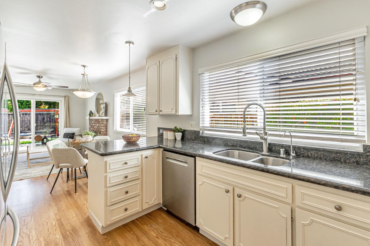 824 Buchser Way San Jose, CA 95125 - Photo 17 of 50 a kitchen with granite countertop a sink and white cabinets