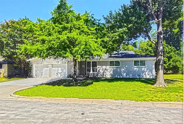 a view of a house with a swimming pool