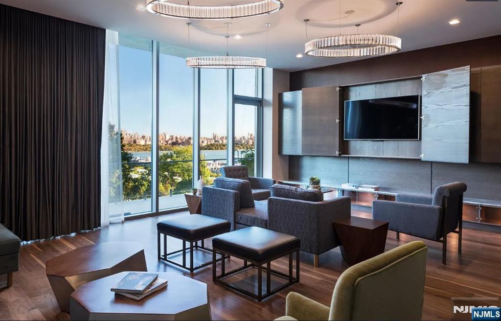 320 Adolphus Avenue, Unit 1013 Cliffside Park, NJ 07010 - Photo 11 of 18 a view of a livingroom with furniture and a flat screen tv