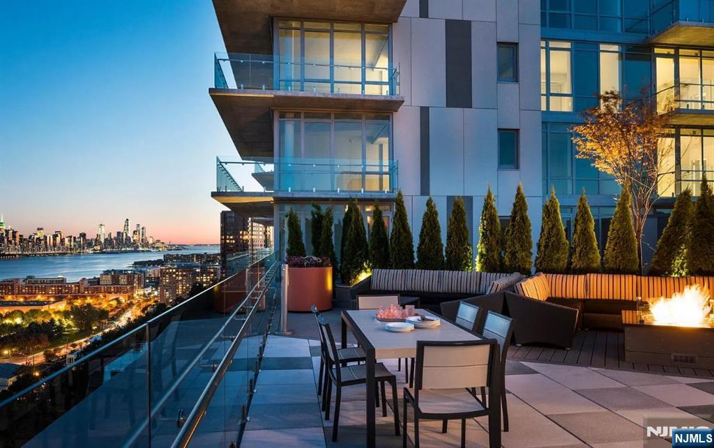 320 Adolphus Avenue, Unit 1013 Cliffside Park, NJ 07010 - Photo 15 of 18 a balcony with table and chairs