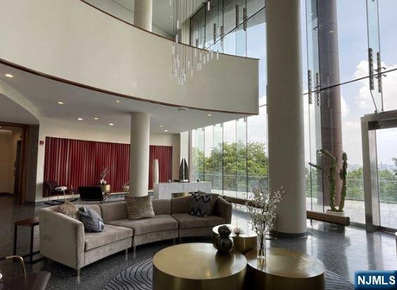 320 Adolphus Avenue, Unit 1013 Cliffside Park, NJ 07010 - Photo 16 of 18 a living room with furniture and a large window