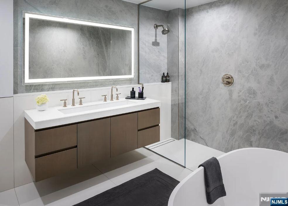 320 Adolphus Avenue, Unit 1013 Cliffside Park, NJ 07010 - Photo 4 of 18 a bathroom with a sink a toilet and shower