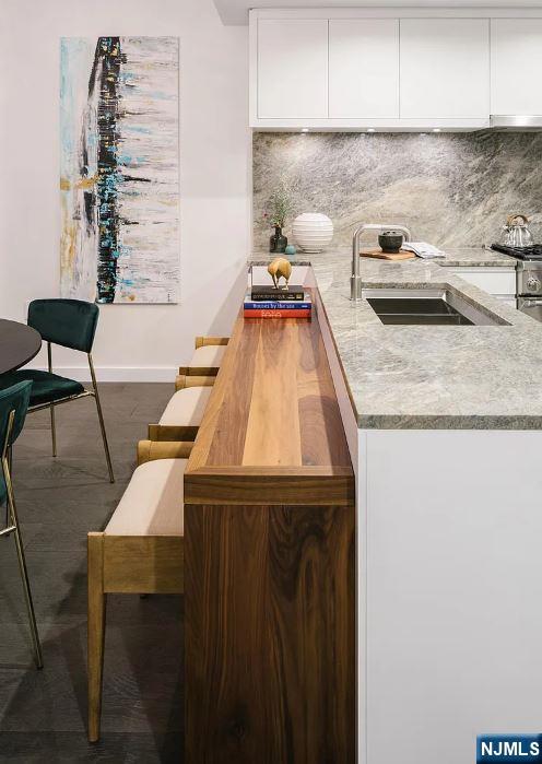 320 Adolphus Avenue, Unit 1013 Cliffside Park, NJ 07010 - Photo 5 of 18 a kitchen with a sink and cabinets