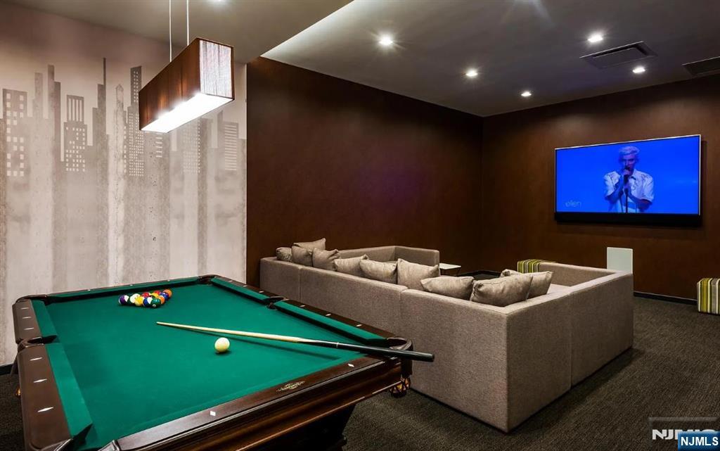 320 Adolphus Avenue, Unit 1013 Cliffside Park, NJ 07010 - Photo 9 of 18 a room with furniture and screen