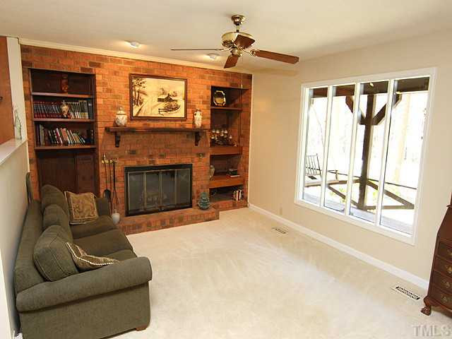 4105 Fiesta Road Durham, NC 27703 - Photo 17 of 25 a living room with furniture a window and a flat screen tv