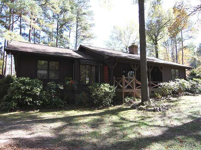 4105 Fiesta Road Durham, NC 27703 - Photo 2 of 25 a view of house with backyard and garden