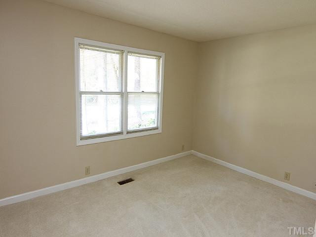 4105 Fiesta Road Durham, NC 27703 - Photo 21 of 25 an empty room with a window