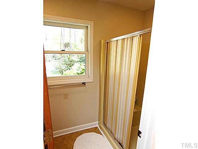 4105 Fiesta Road Durham, NC 27703 - Photo 23 of 25 a view of a door and chair in a room