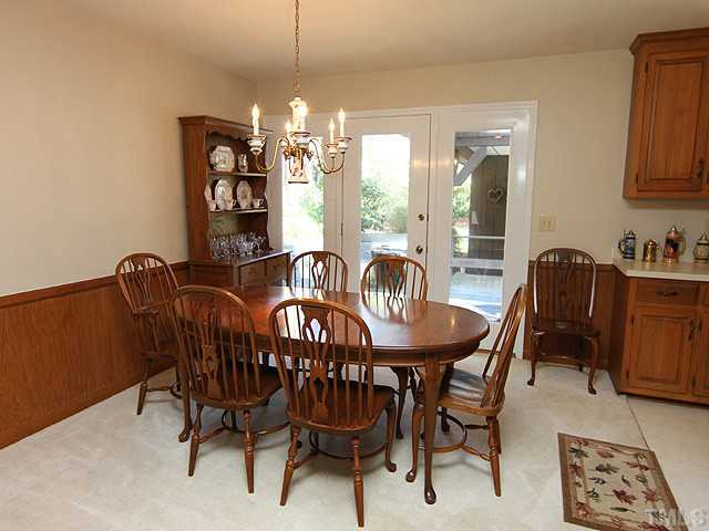 4105 Fiesta Road Durham, NC 27703 - Photo 10 of 25 a view of a a dining room with furniture window and outside view