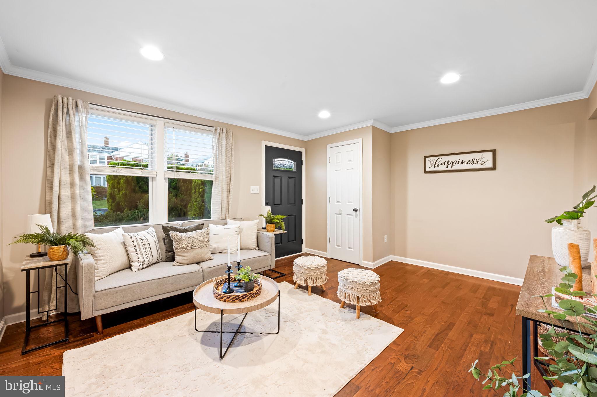 1817 Dunmere Road Baltimore, MD 21222 - Photo 5 of 27 a living room with furniture and a large window
