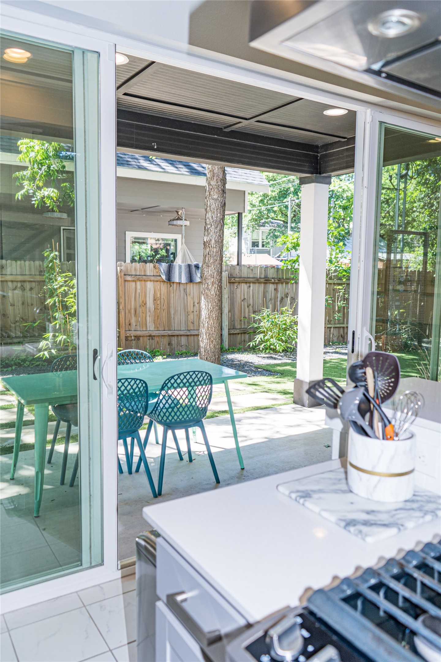 2714 East 3rd Street, Unit 2 Austin, TX 78702 - Photo 9 of 13 a dining room with furniture and a floor to ceiling window