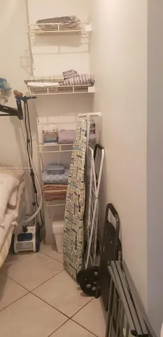 a white toilet sitting next to a shower