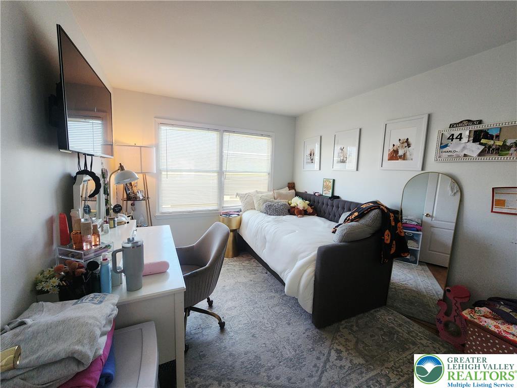 237 Ridings Circle Macungie, PA 18062 - Photo 57 of 70 Natural light pours through wide windows onto the carpeted floor of this versatile bedroom.