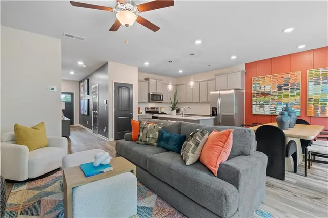 a living room with furniture and a large window