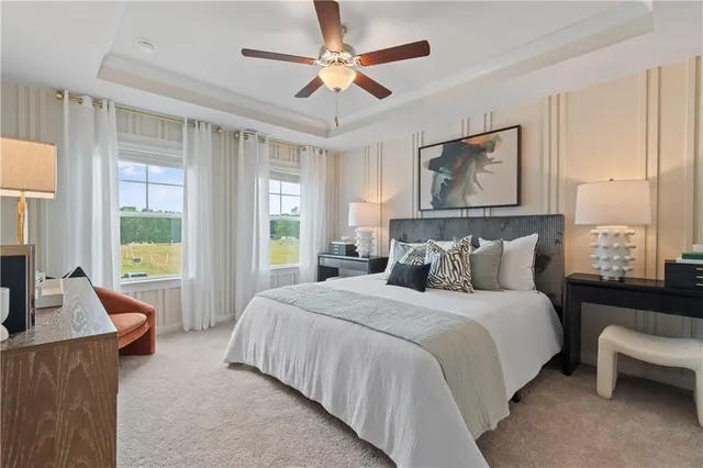 a bedroom with a large bed and a couch