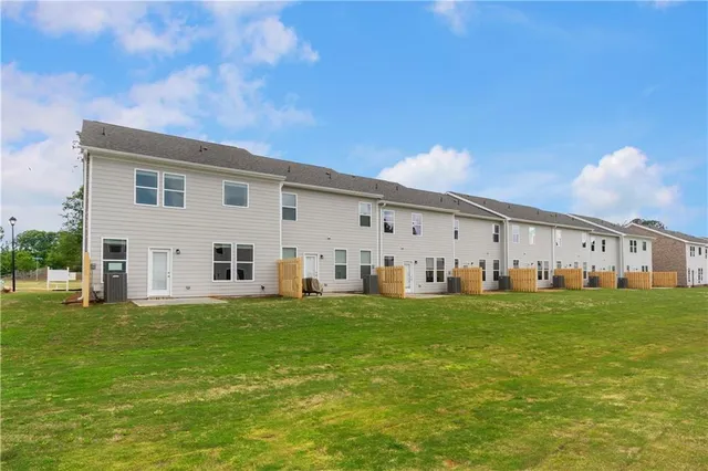 a big white house with a yard