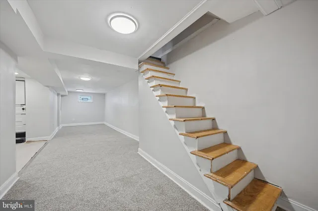 an entryway in a room with white walls