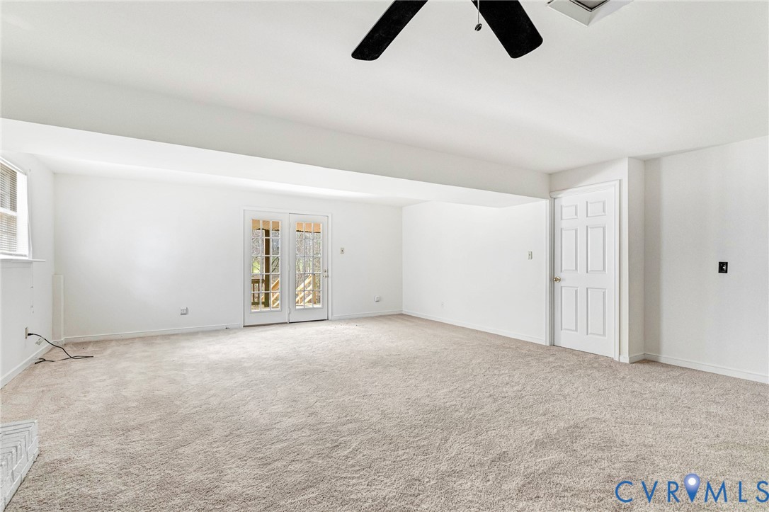 9107 Mossy Brook Road Mechanicsville, VA 23116 - Photo 11 of 30 Spare room featuring a ceiling fan and light carpe