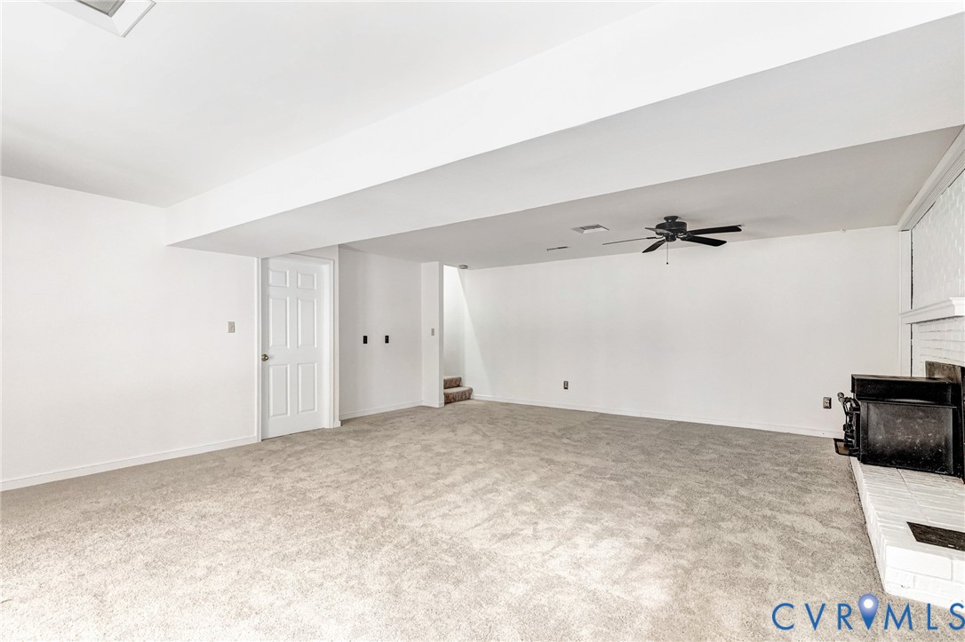 9107 Mossy Brook Road Mechanicsville, VA 23116 - Photo 13 of 30 Unfurnished living room with a fireplace, a ceilin